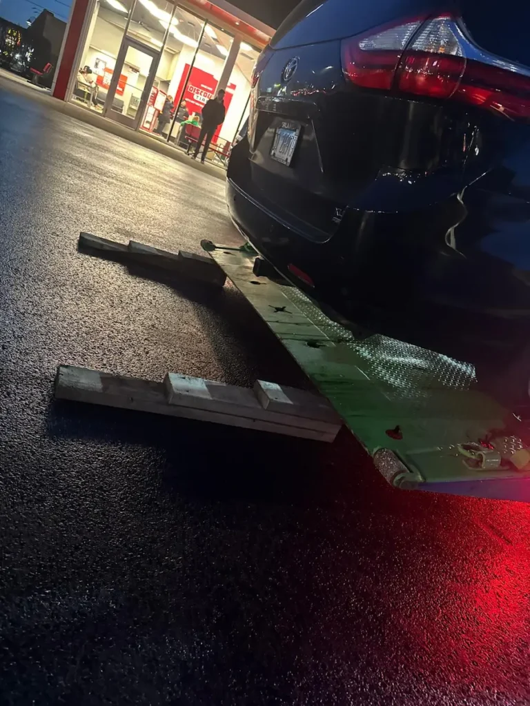 Flatbed towing ramp used to protect vehicle from damage during loading in Chicago suburbs